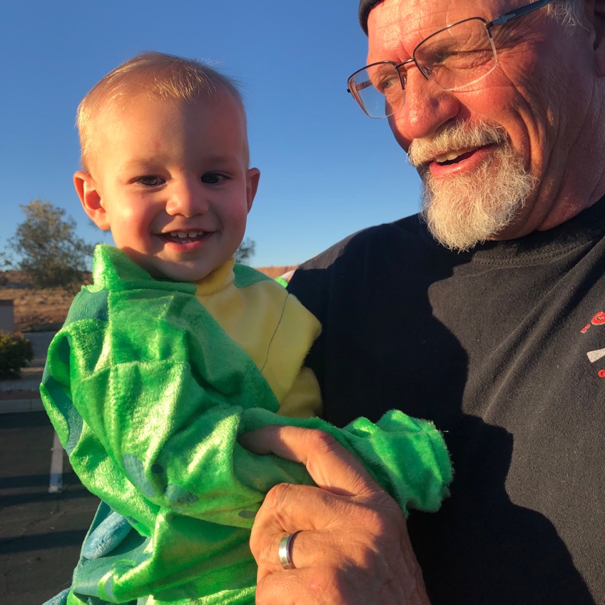 baby and grandpa smiling
